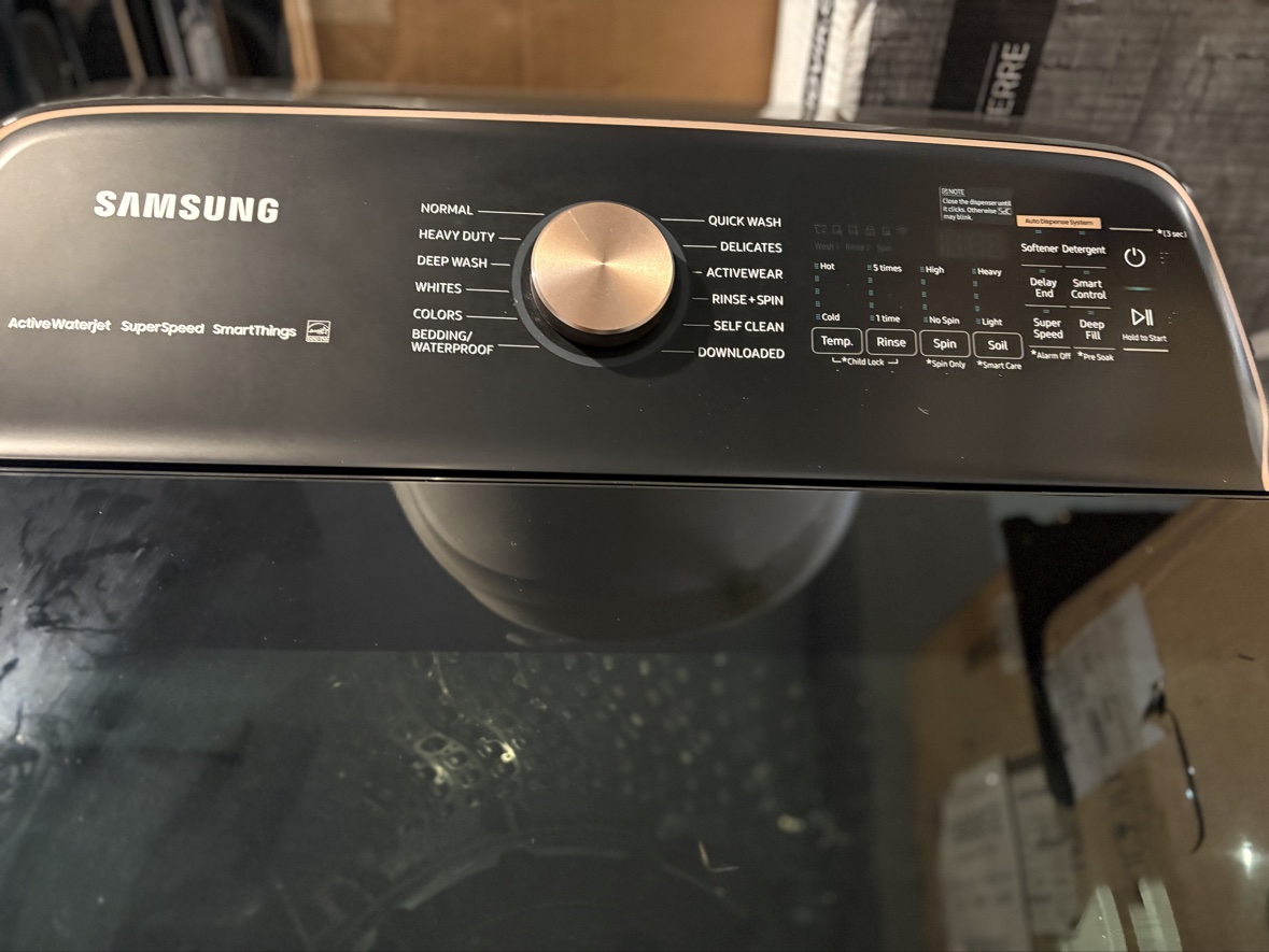 Samsung washer control panel with ActiveWaterJet, SuperSpeed and SmartThings labels and a rose gold dial