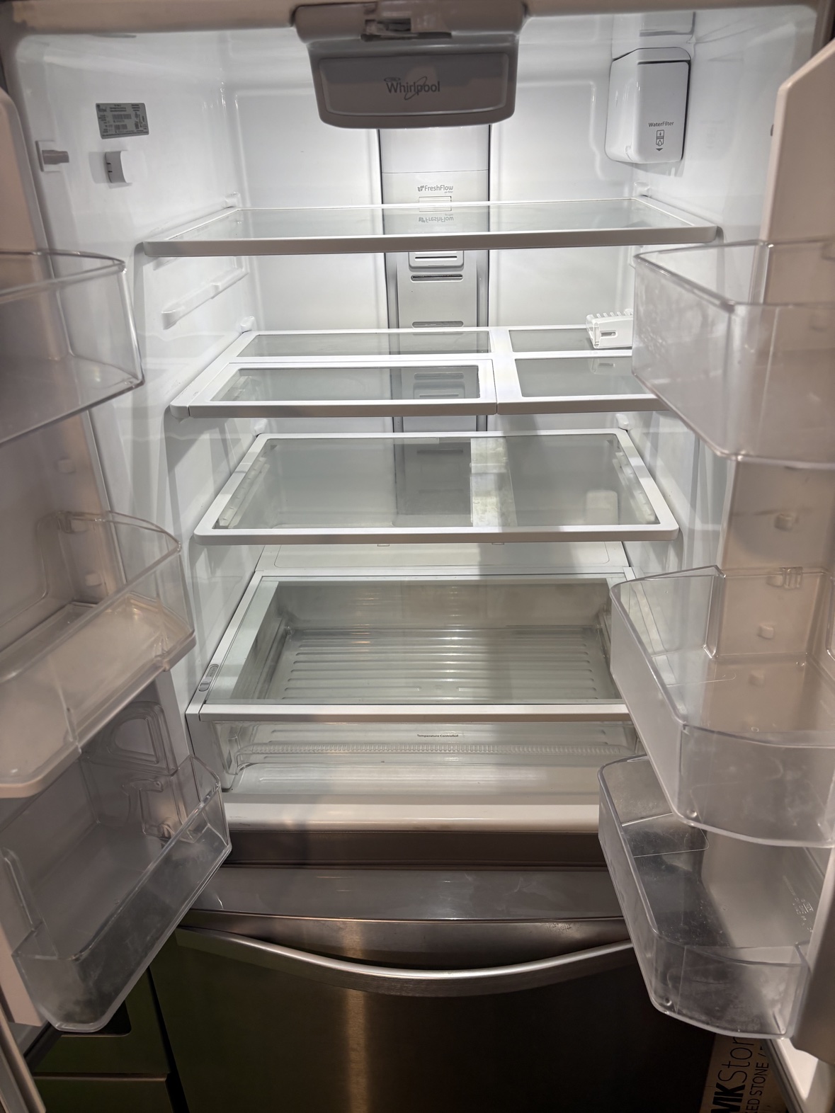Inside the Whirlpool French door refrigerator, showing the shelves and bins