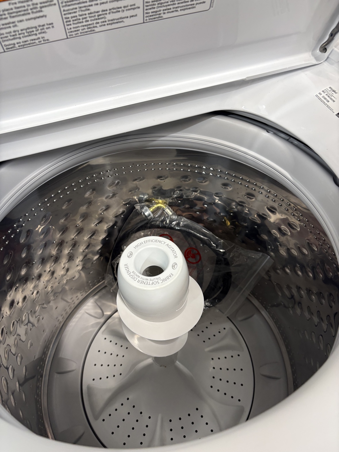 Inside the stainless steel Whirlpool washer drum with agitator